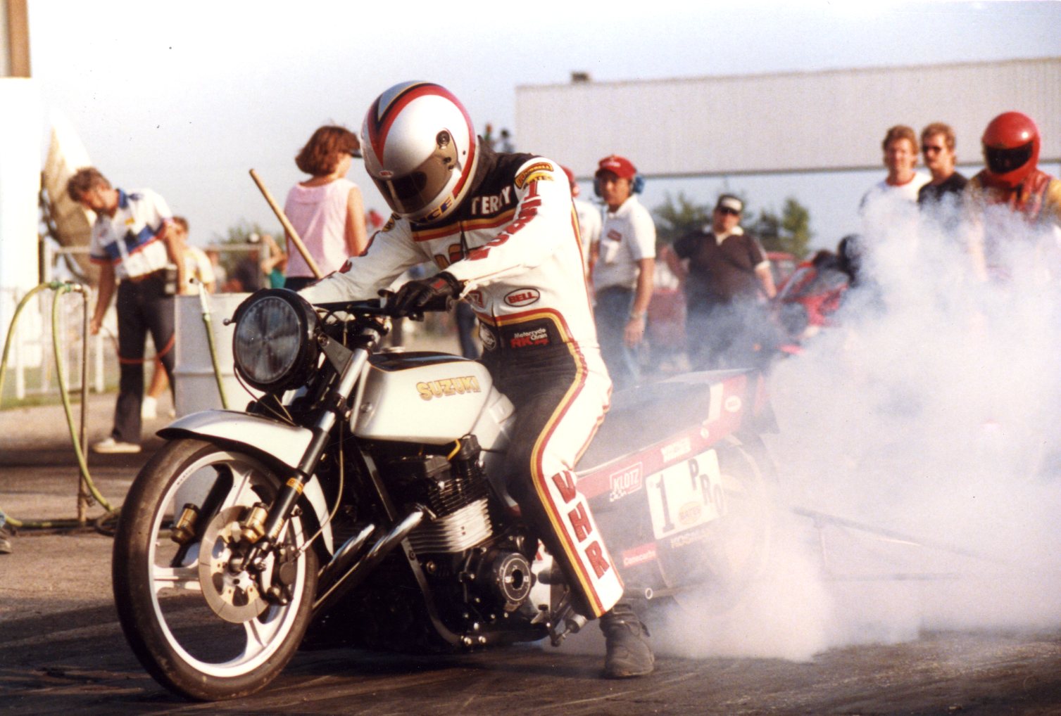 A vintage view of a NHRA PSM drag Bike on the strip