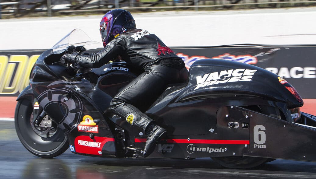 A view of a NHRA PSM drag Bike on the strip