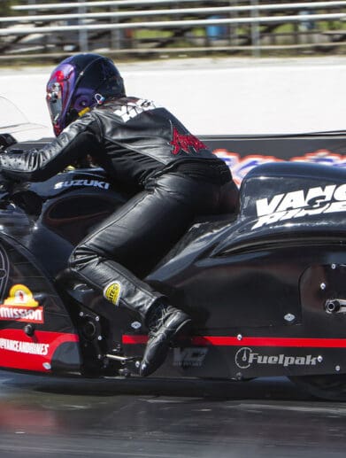 A view of a NHRA PSM drag Bike on the strip