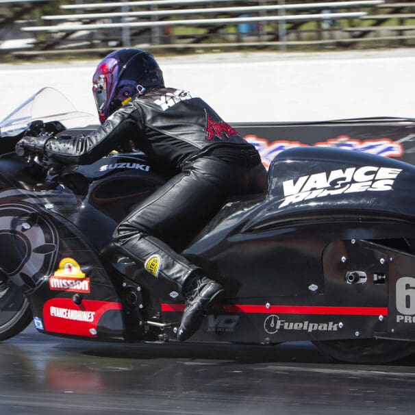 A view of a NHRA PSM drag Bike on the strip