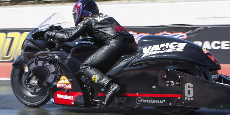 A view of a NHRA PSM drag Bike on the strip