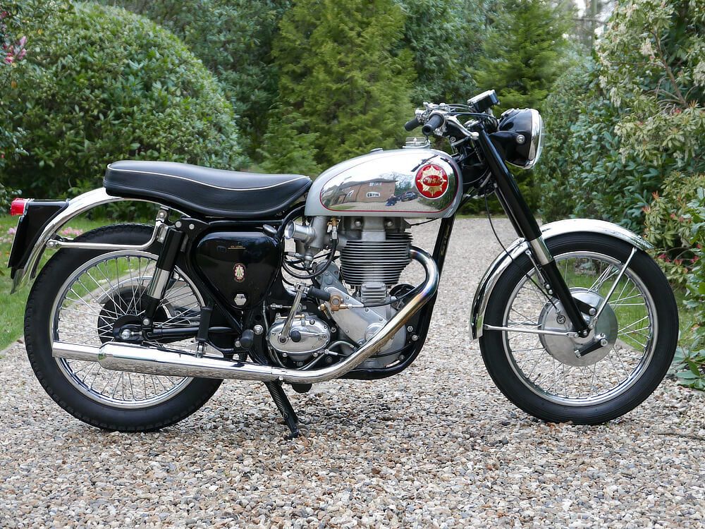 An original BSA Gold Star motorcycle outdoors on a driveway