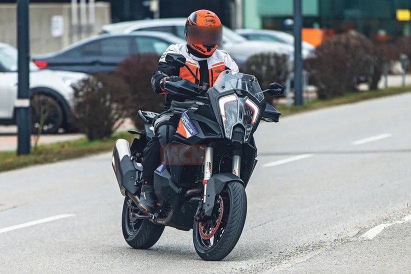 A view of the KTM Super Adventure being taken for a scoot about the block with road-going tires, Ducati Pike Peak style.