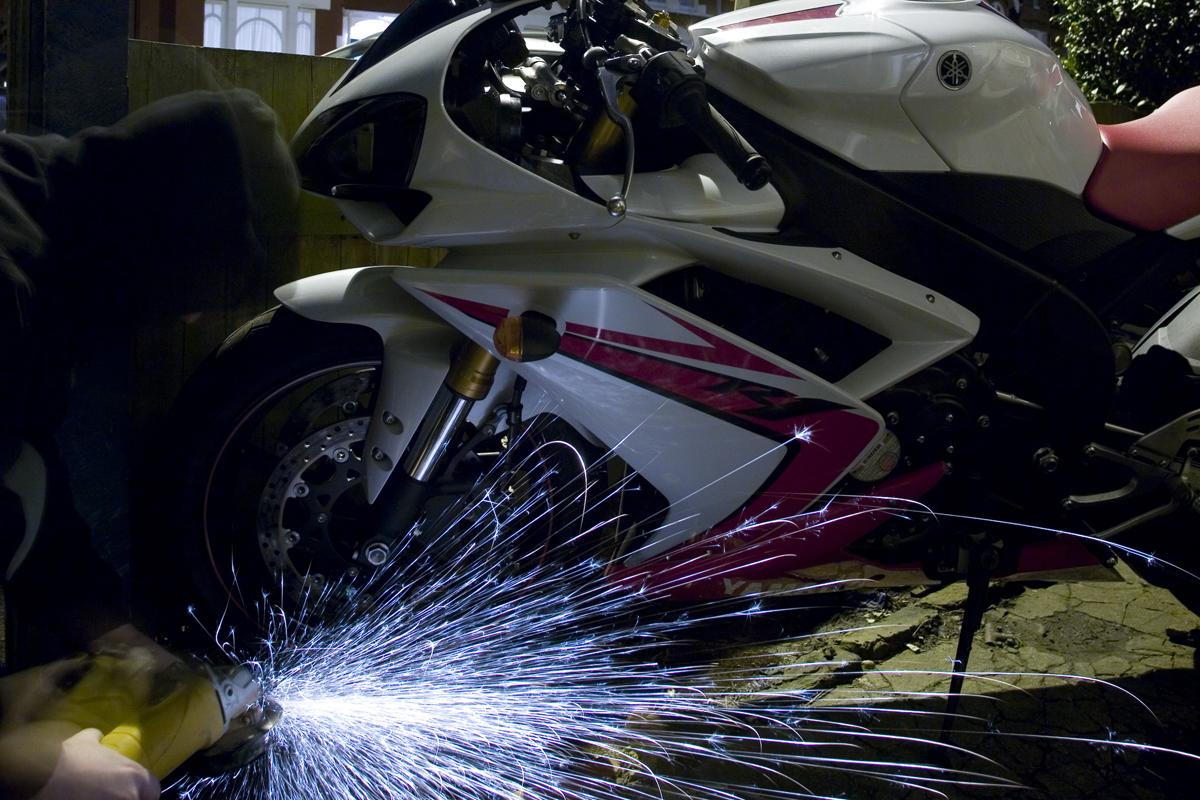 A view of someone cutting a lock on your motorcycle