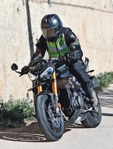 A view of the new machine that Triumph's been taking out for tests - note the new gold Ohlins suspension, the changes to the bodywork, splitter at the front, and higher raised clip-ons.