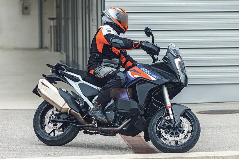 A view of the KTM Super Adventure being taken for a scoot about the block with road-going tires, Ducati Pike Peak style.