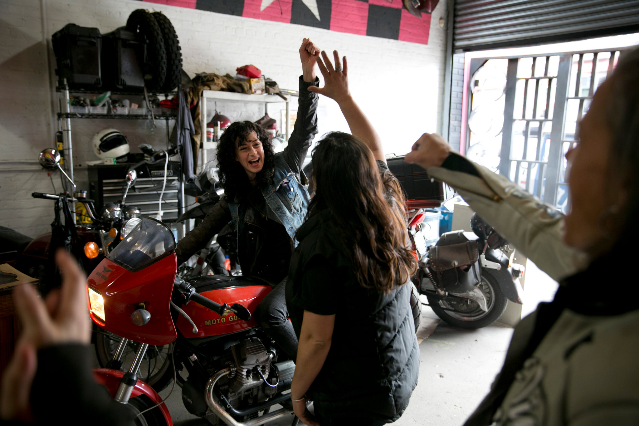 two women clapping a high-five