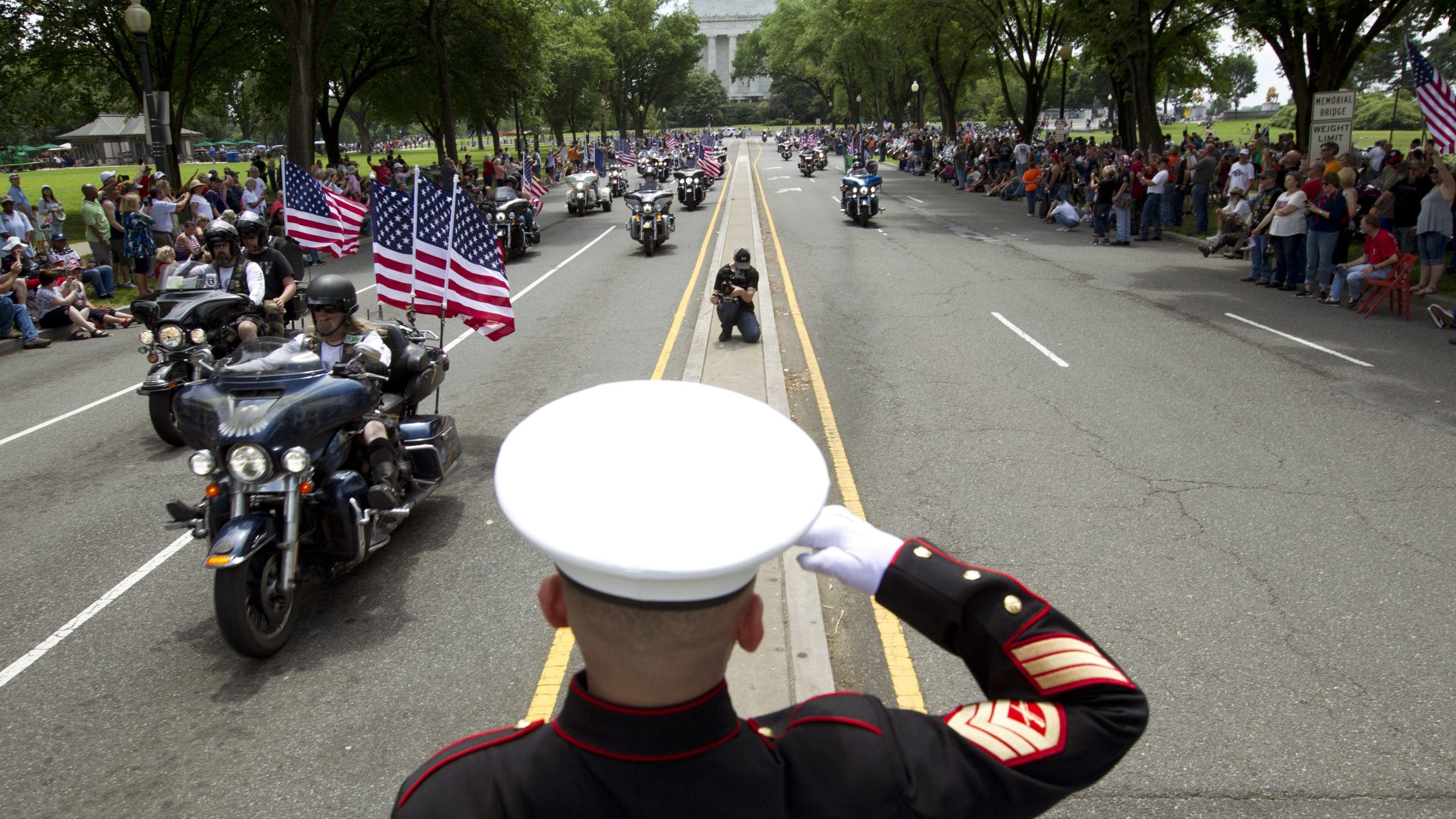 U.S. Marine Tim Chambers salutes participants in last year's Rolling Thunder motorcycle demonstration.