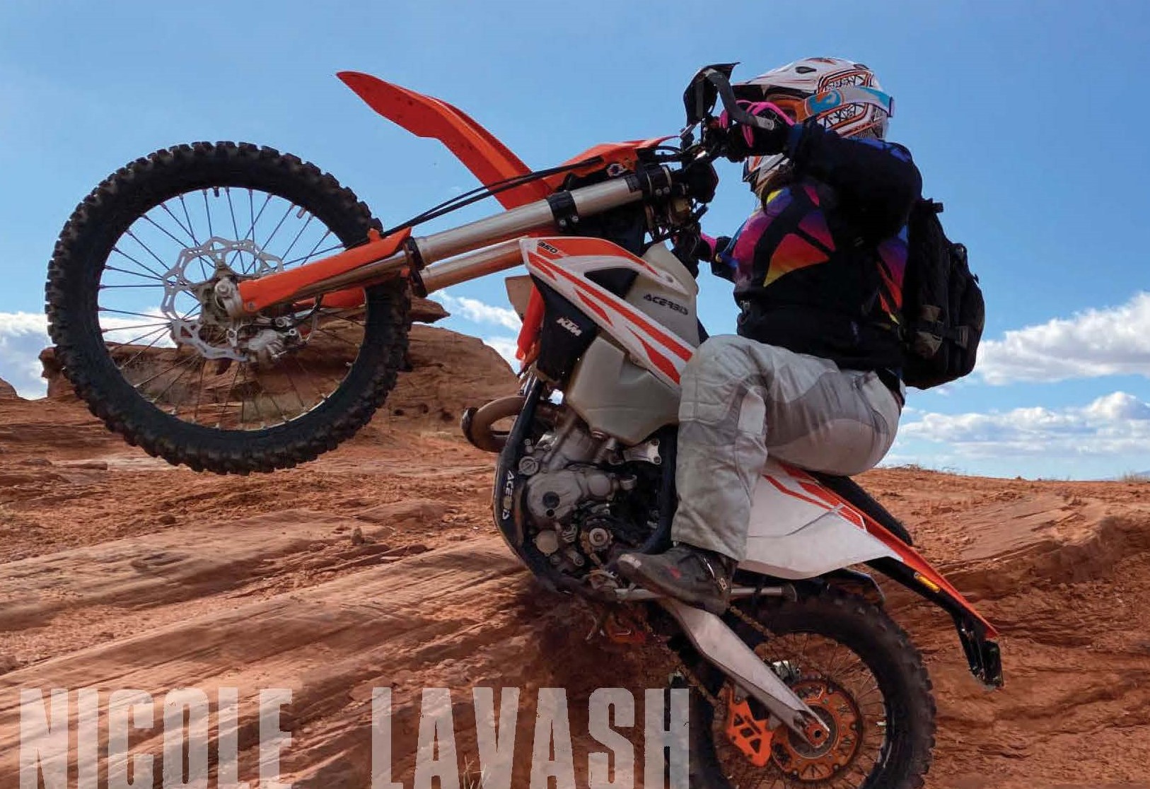 A side view of Nicole Lavash on her MX bike