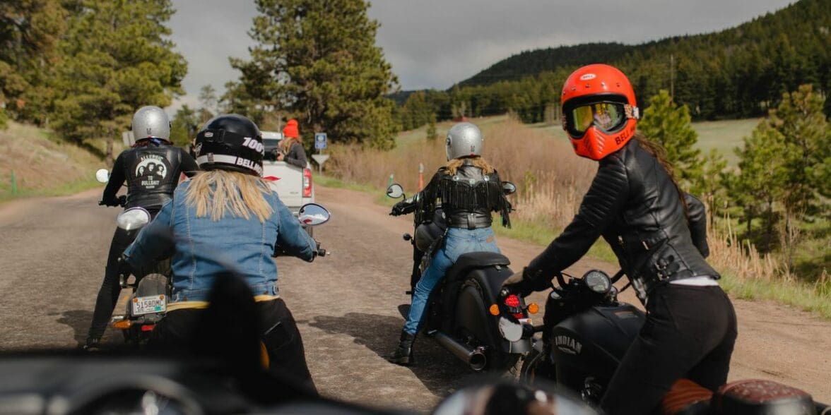 A back view of female motorcycle riders