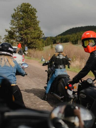 A back view of female motorcycle riders