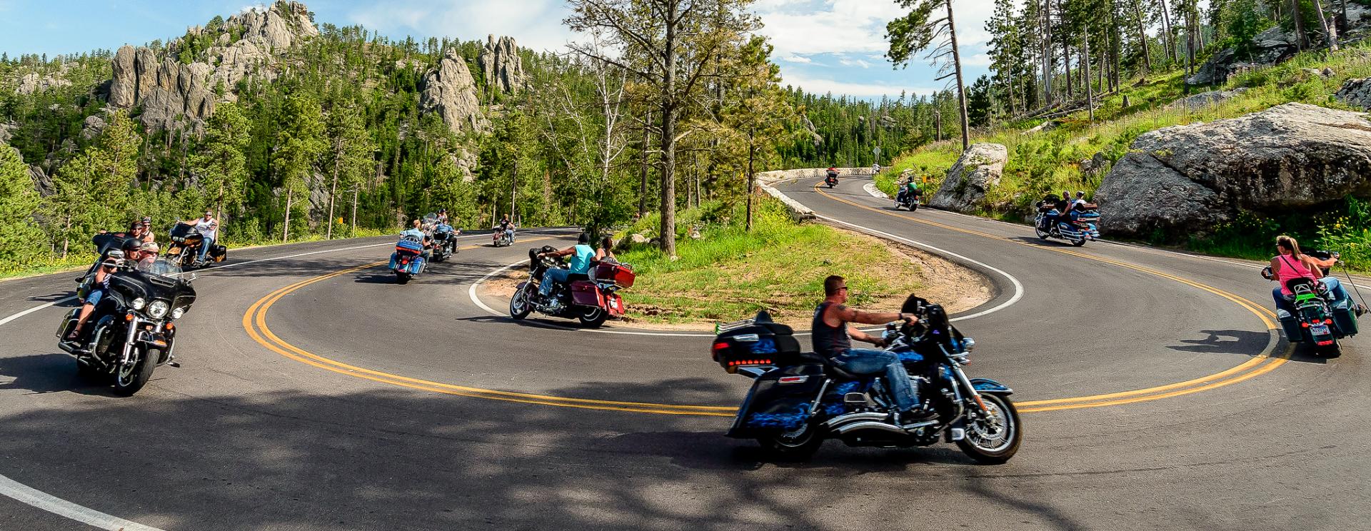 A view of a motorcycle rally that took place in 2021: Many motorcycles ride around as riders reacquaint each other post-COVID