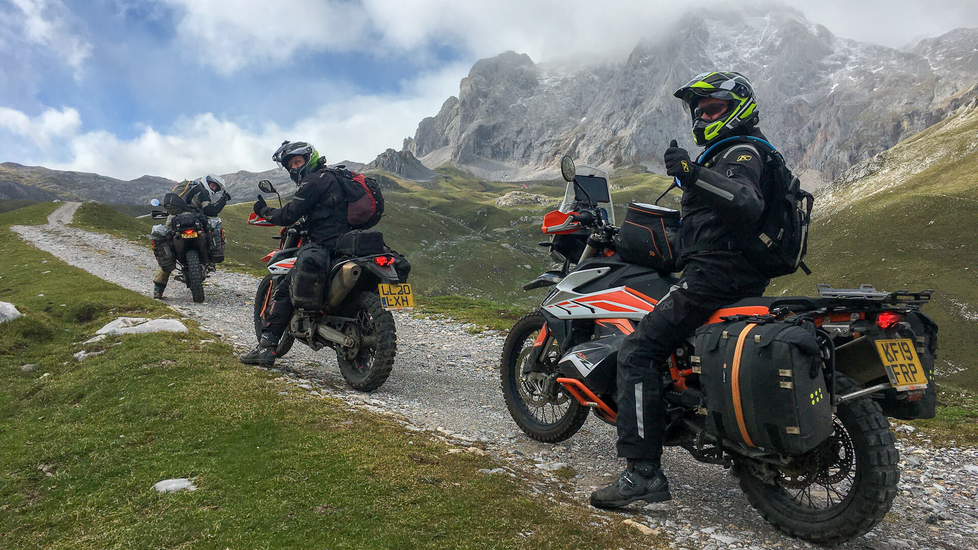 adventure motorcycle riders enjoying a blue sky and rugged landscape