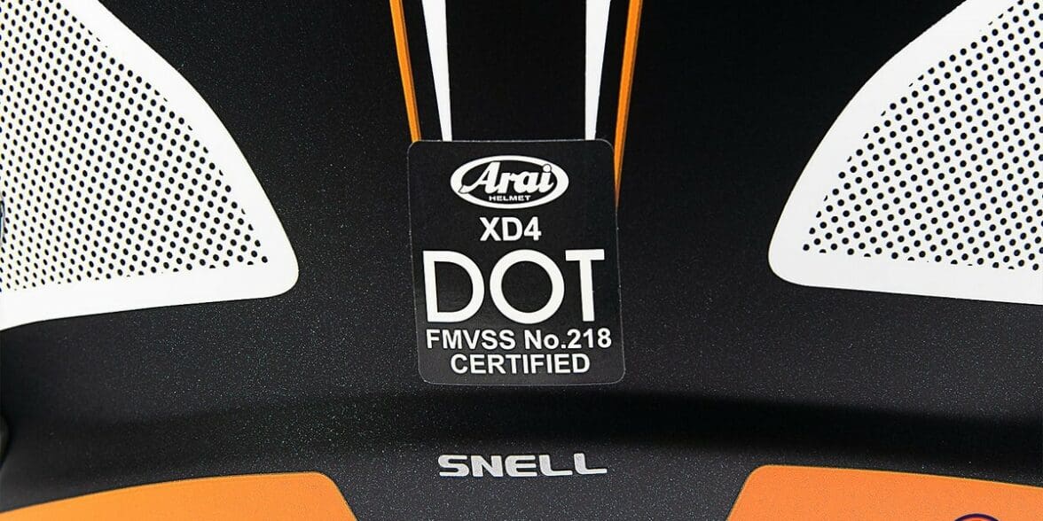 The safety certification sticker from an Arai XD4 helmet