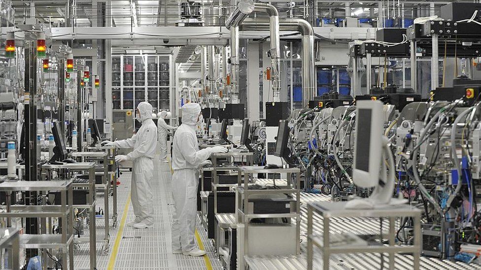 People working in a semiconductor factory