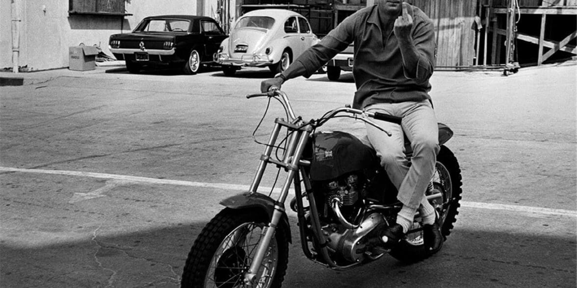 Steve McQueen on his Metisse Desert Racer in a Hollywood lot car park