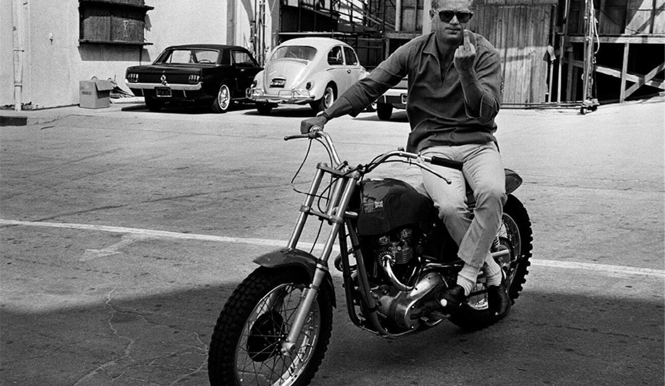 Steve McQueen on his Metisse Desert Racer in a Hollywood lot car park