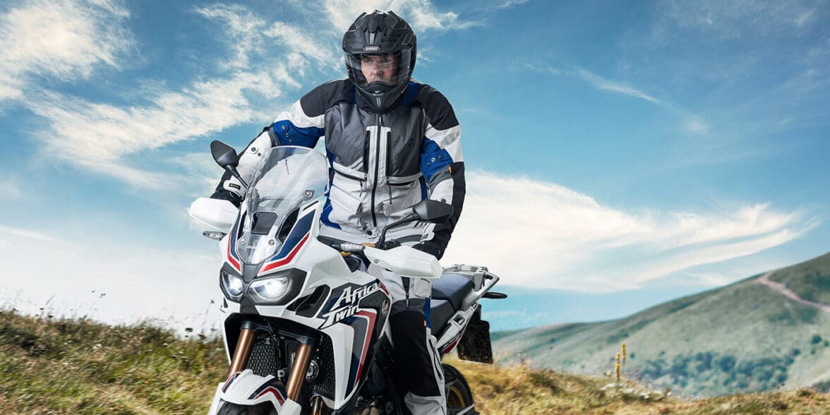 Rider in Rukka Hi-Vis riding jacket on motorcycle off-road