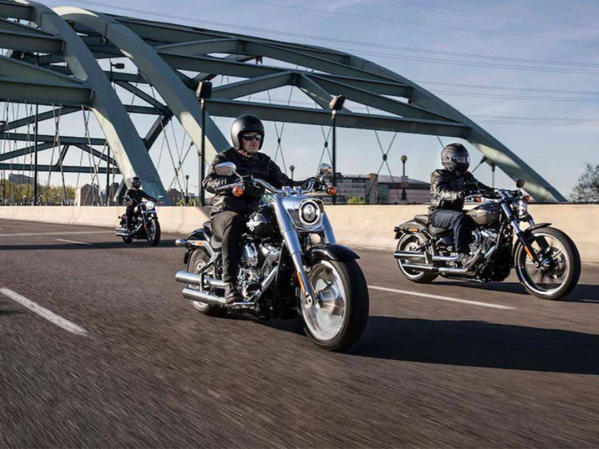 Harley riders enjoying riding across a bridge