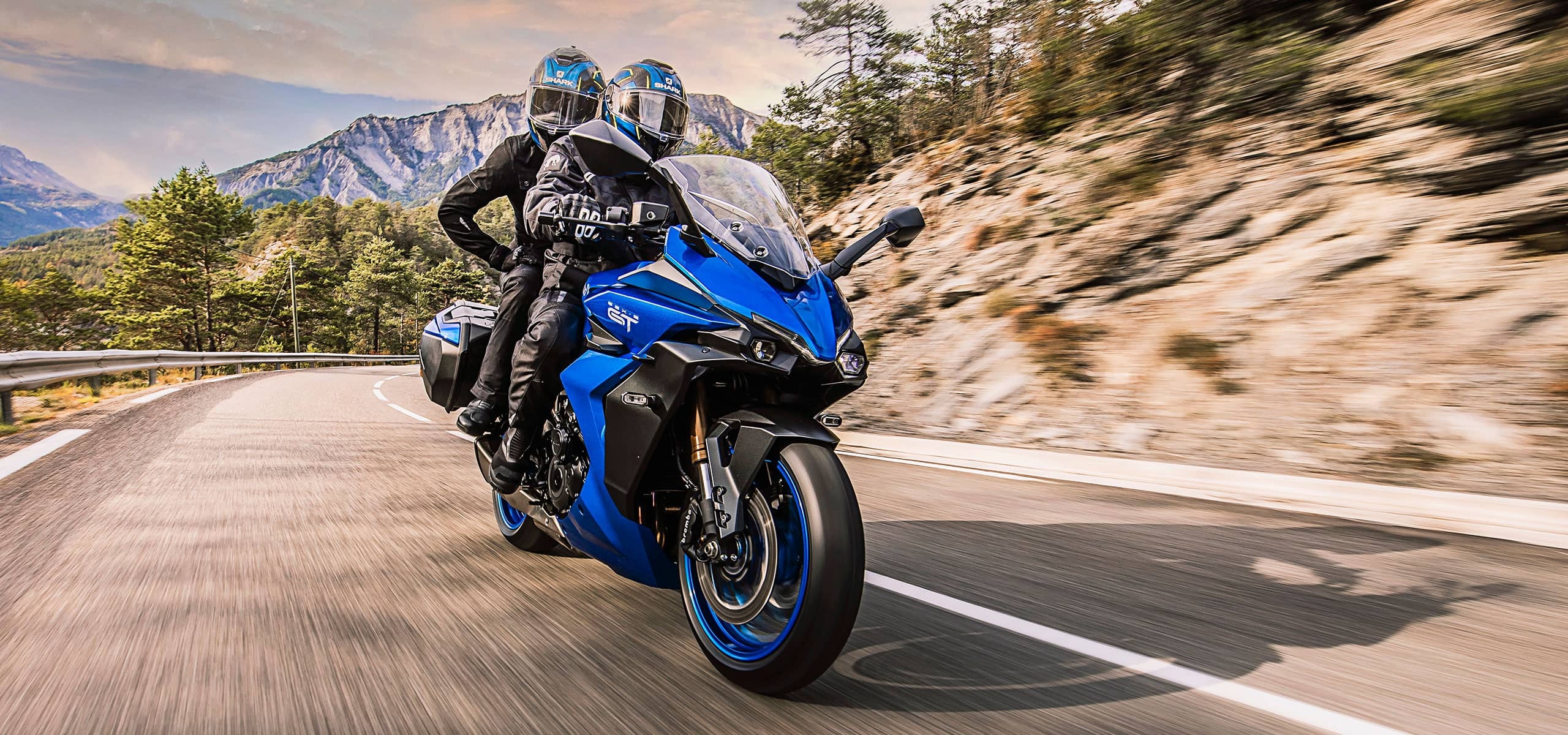 A view of motorcycle riders enjoying nice weather on the road