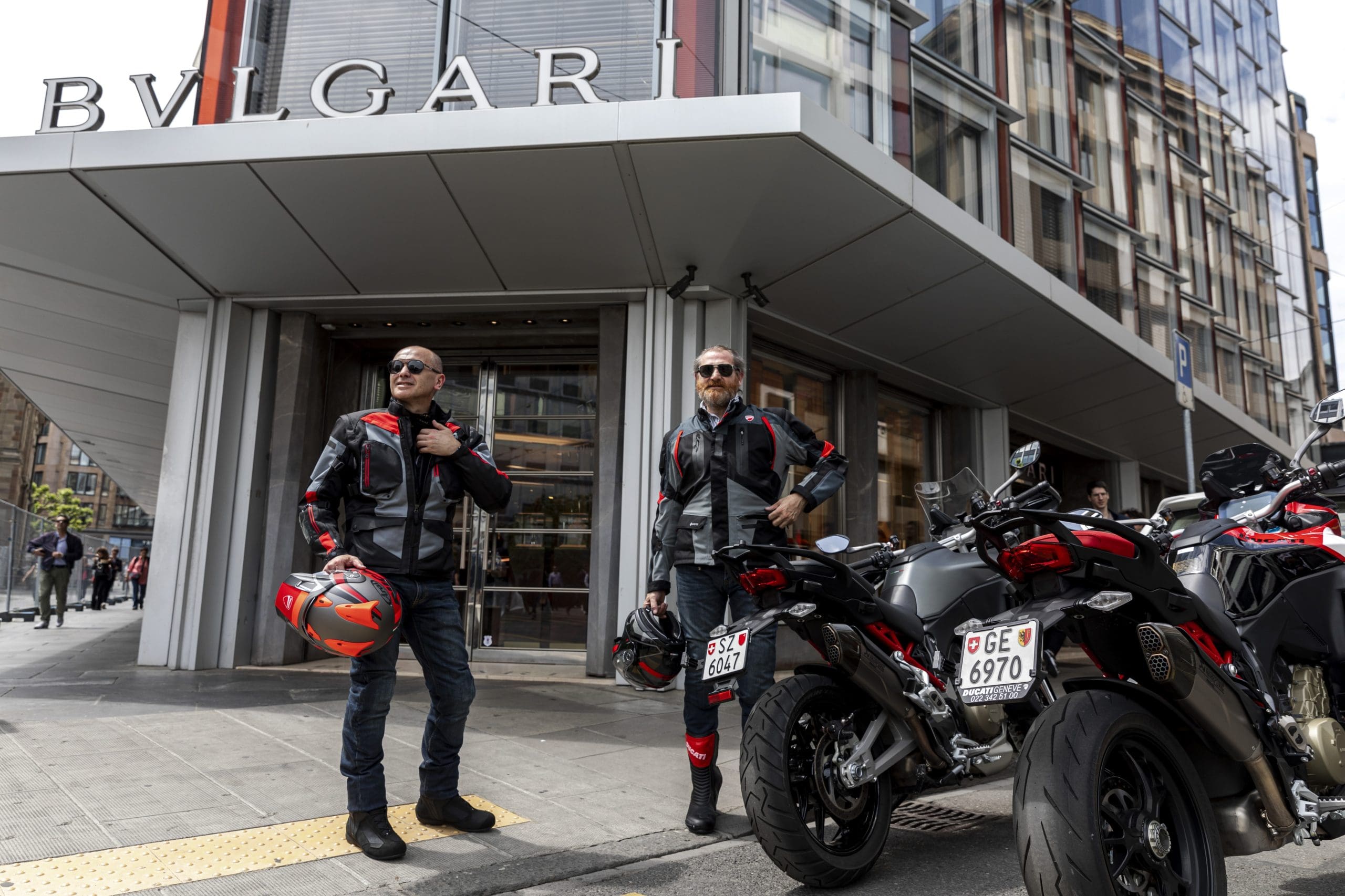 two motorcyclists showcasing the Bulgari Aluminum Ducati Special Edition chronograph, which is now available on Bulgari's webpage for $5,000 and is advertised as "The best Bulgari watch ever made."