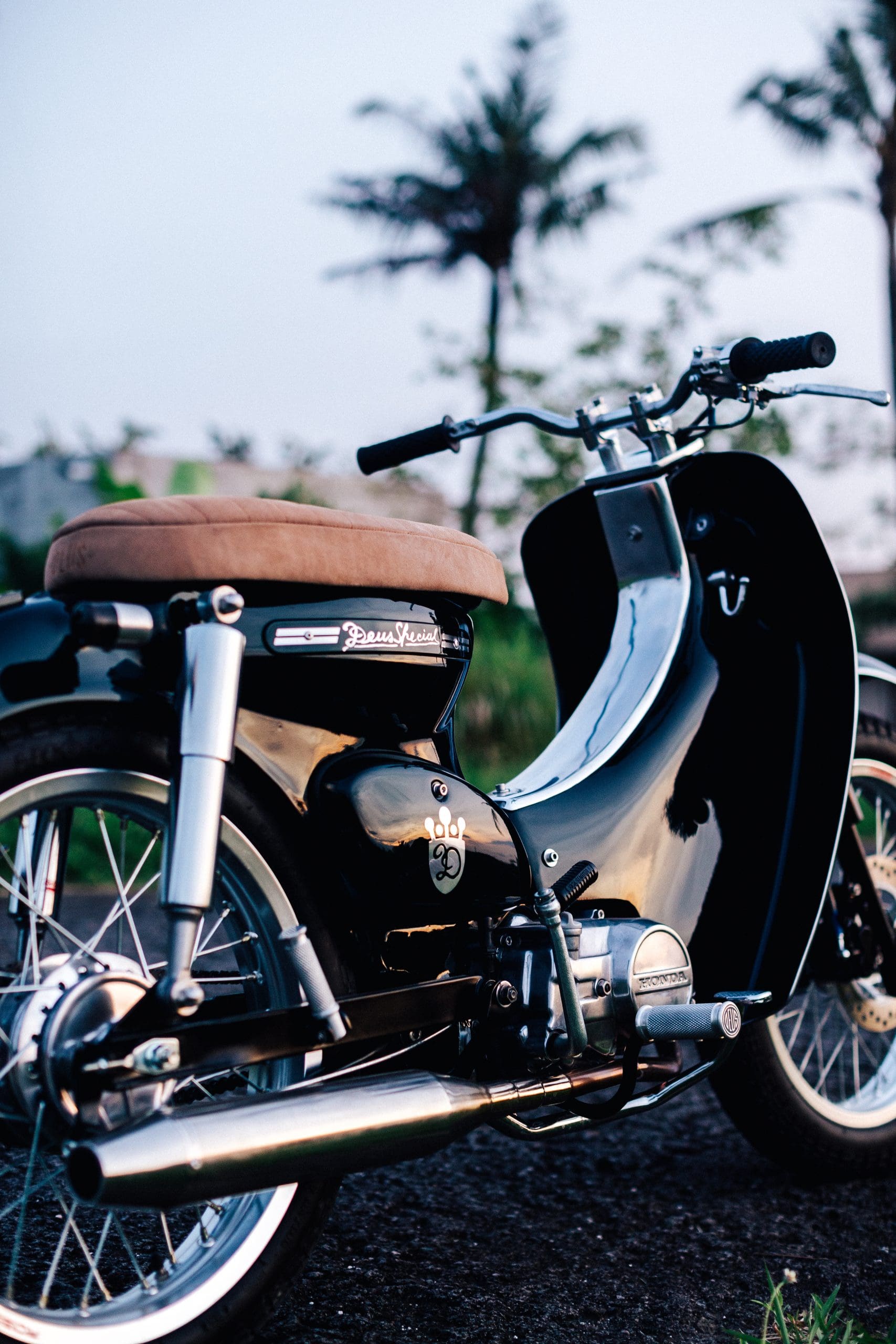 A view of the Honda Cub that was tricked out and refreshed by iconic custom bike shop Deus Customs