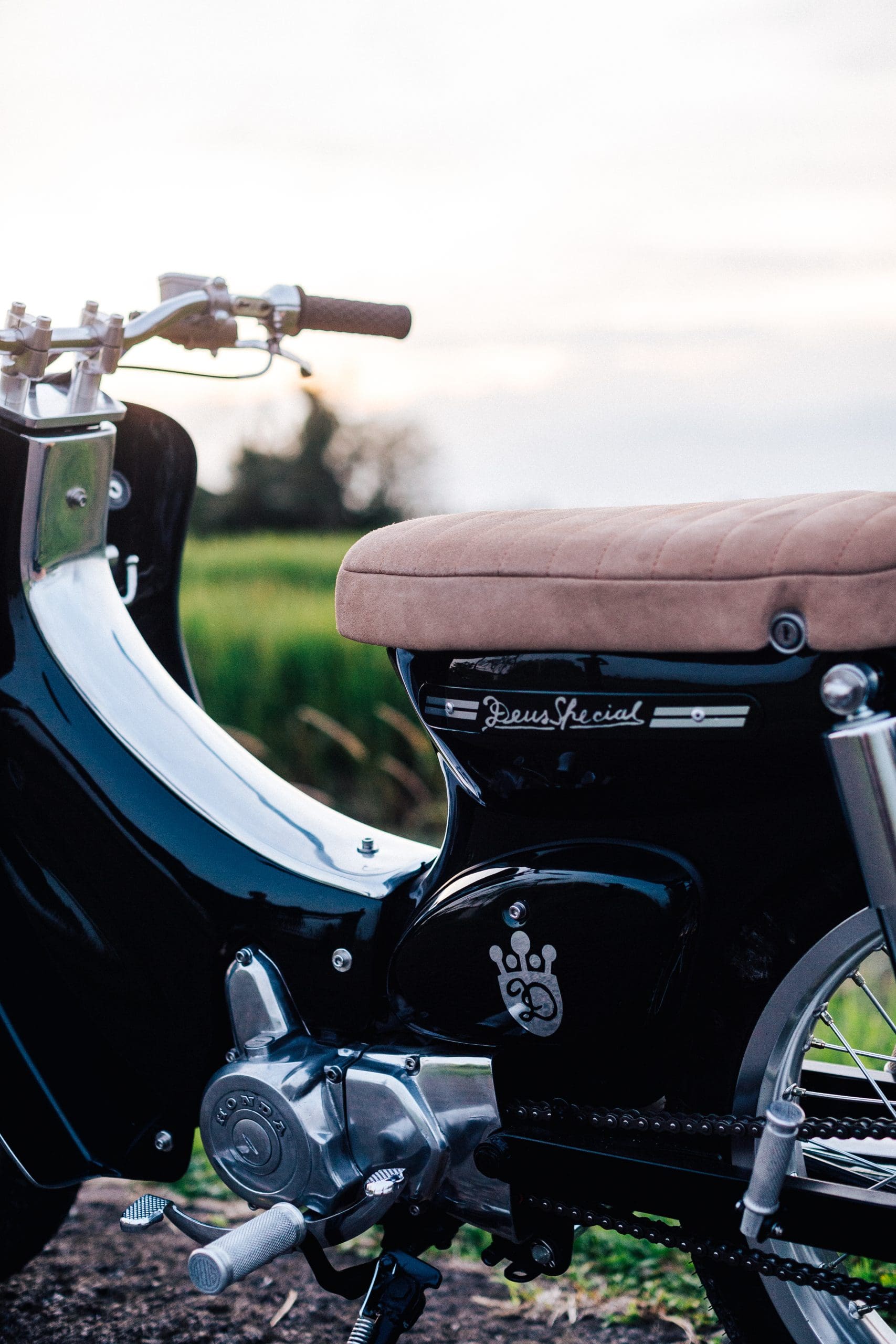 A view of the Honda Cub that was tricked out and refreshed by iconic custom bike shop Deus Customs