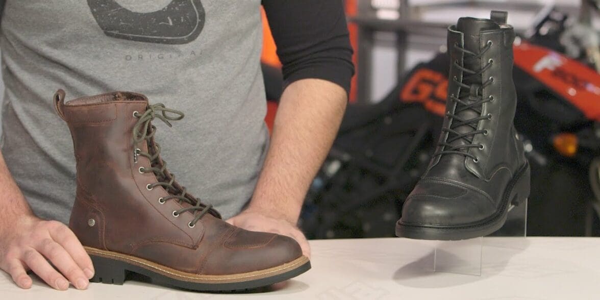 Man holding Spidi X-Nashville Women's Boots on table