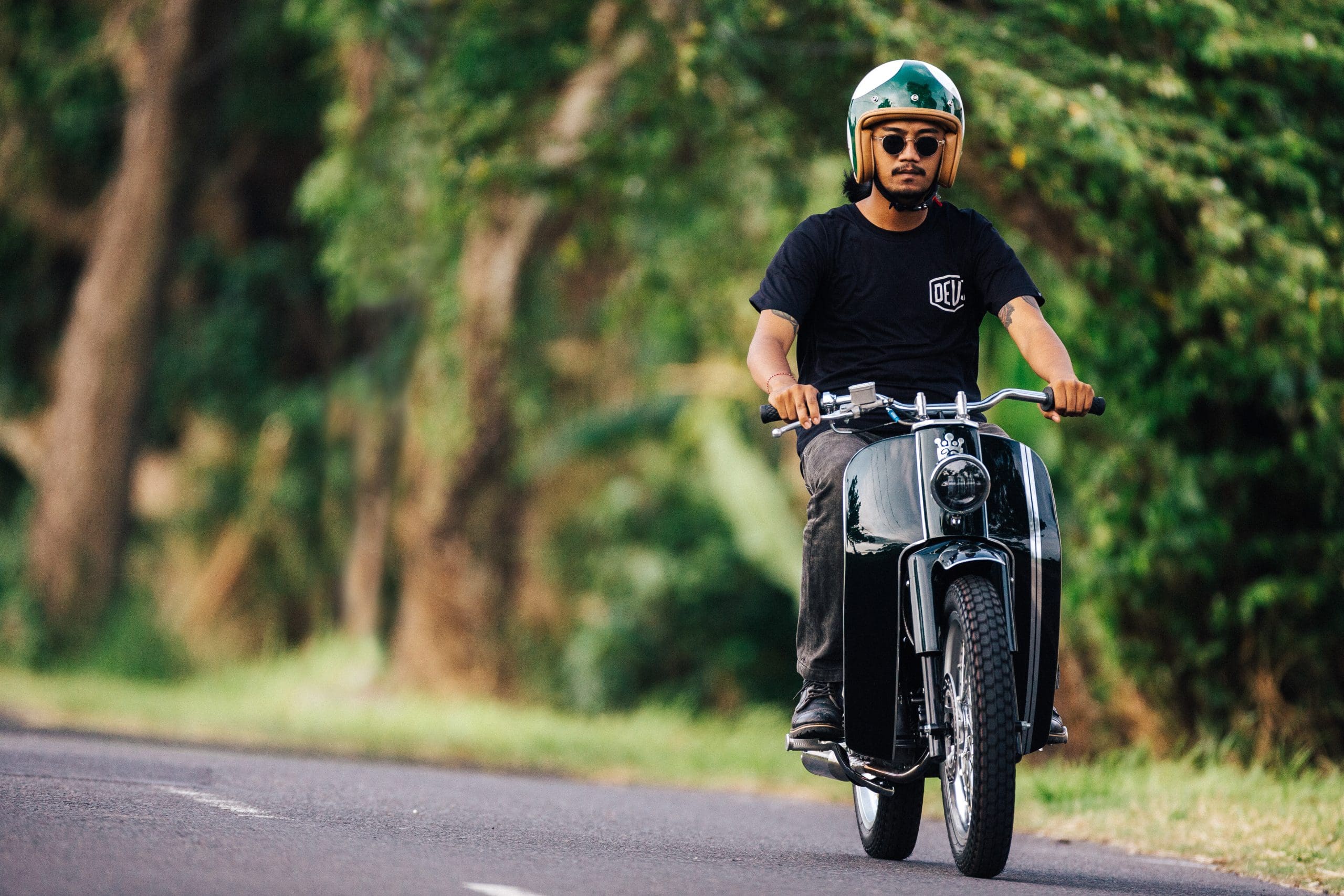 A view of the Honda Cub that was tricked out and refreshed by iconic custom bike shop Deus Customs