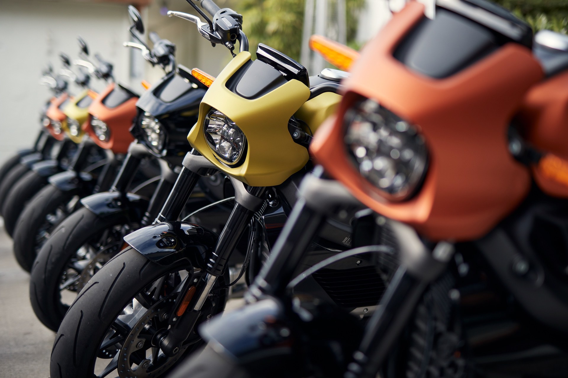 The Harley-Davidson LiveWire motorcycle launch event in India with a row of new bikes waiting to be ridden.