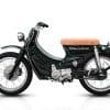 A view of the Honda Cub that was tricked out and refreshed by iconic custom bike shop Deus Customs