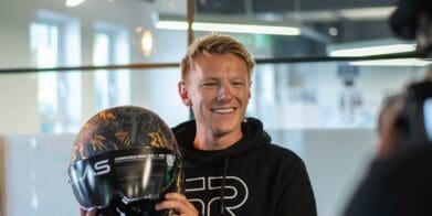 Taylor Mackenzie announces his partnership with Ruroc while holding the recent Atlas 4.0 motorcycle helmet. Photo courtesy of Ruroc's press release.