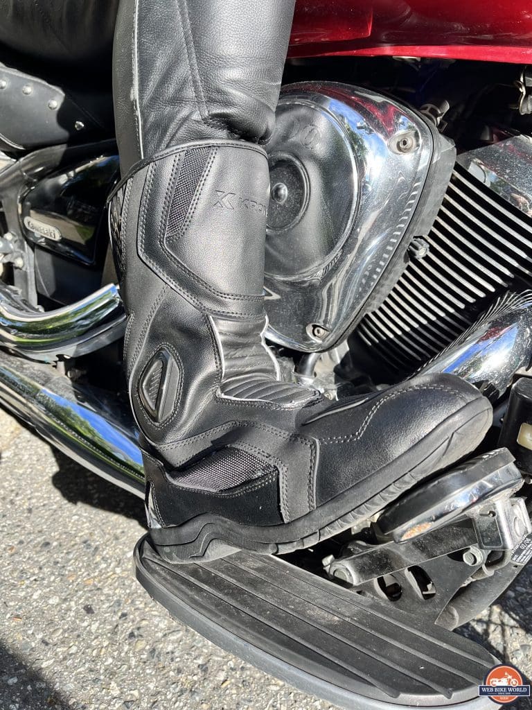 Author wearing Kronox Lanin Boot over leather pants while riding motorcycle