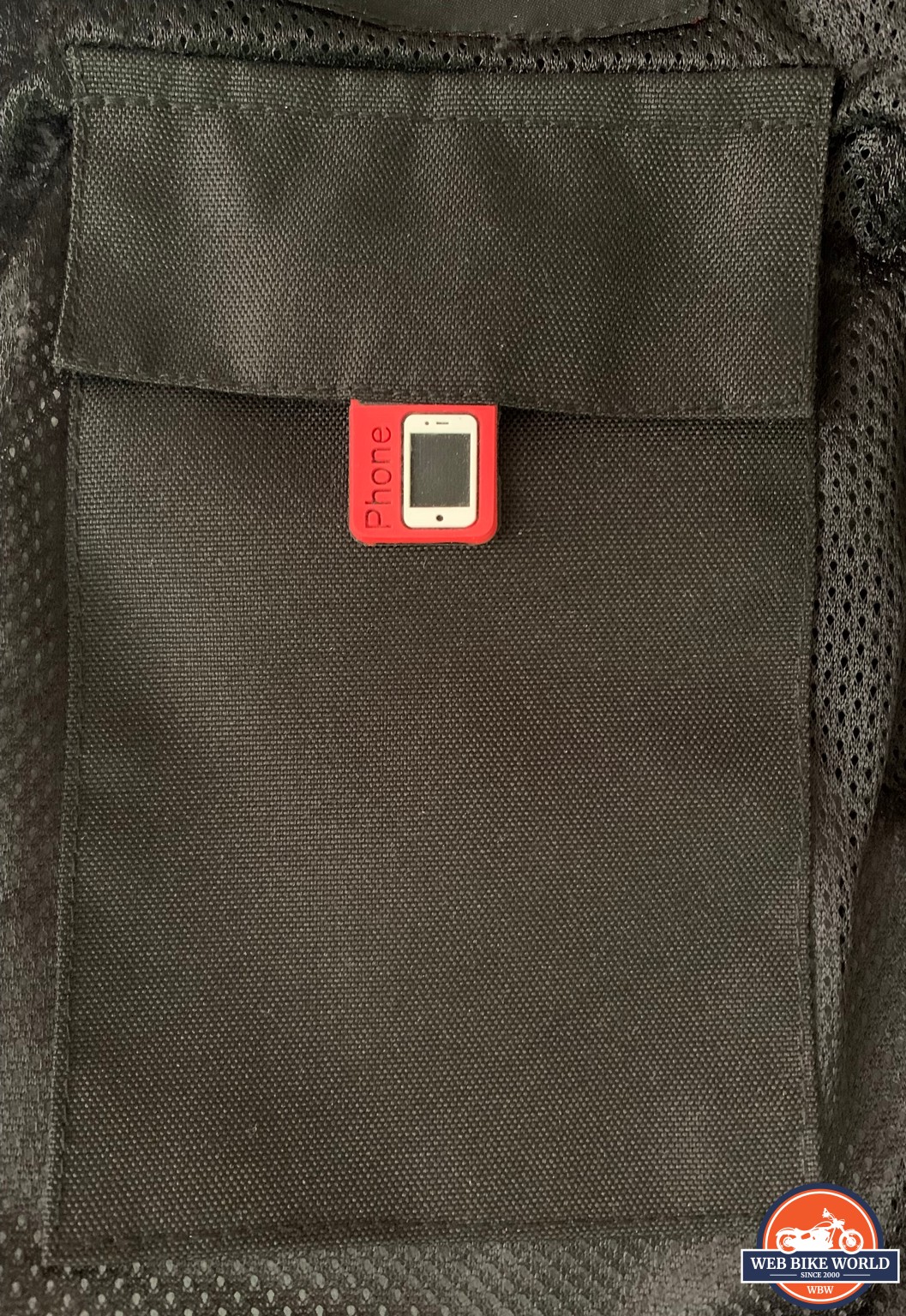 Closeup of a phone pocket on the Gryphon Moto Frontier Jacket