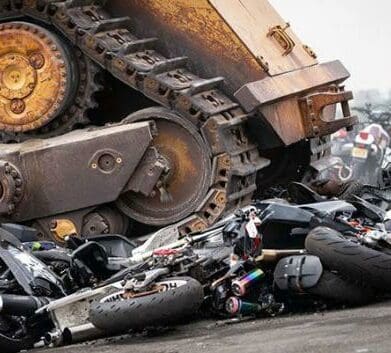 New York's demonstration crushes over 900 bikes confiscated after riders were caught with non road-legal bikes. Photo credited to Gothamist.