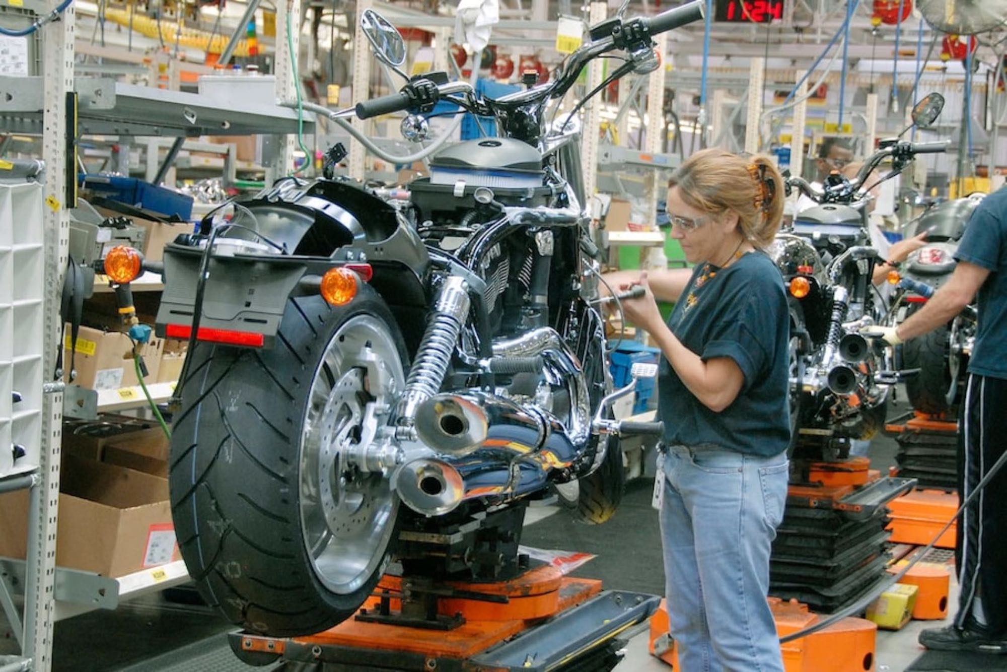 A female worked in a Harley-Davidson production plant assembly line. Photo courtesy of Ultimate Motorcycling.