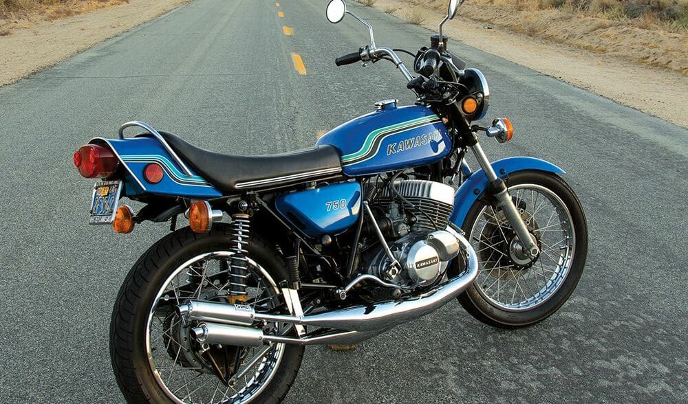 A 1972 kawasaki H2 MkIV motorcycle on a desert road at sunset in America