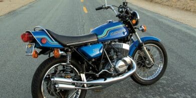 A 1972 kawasaki H2 MkIV motorcycle on a desert road at sunset in America