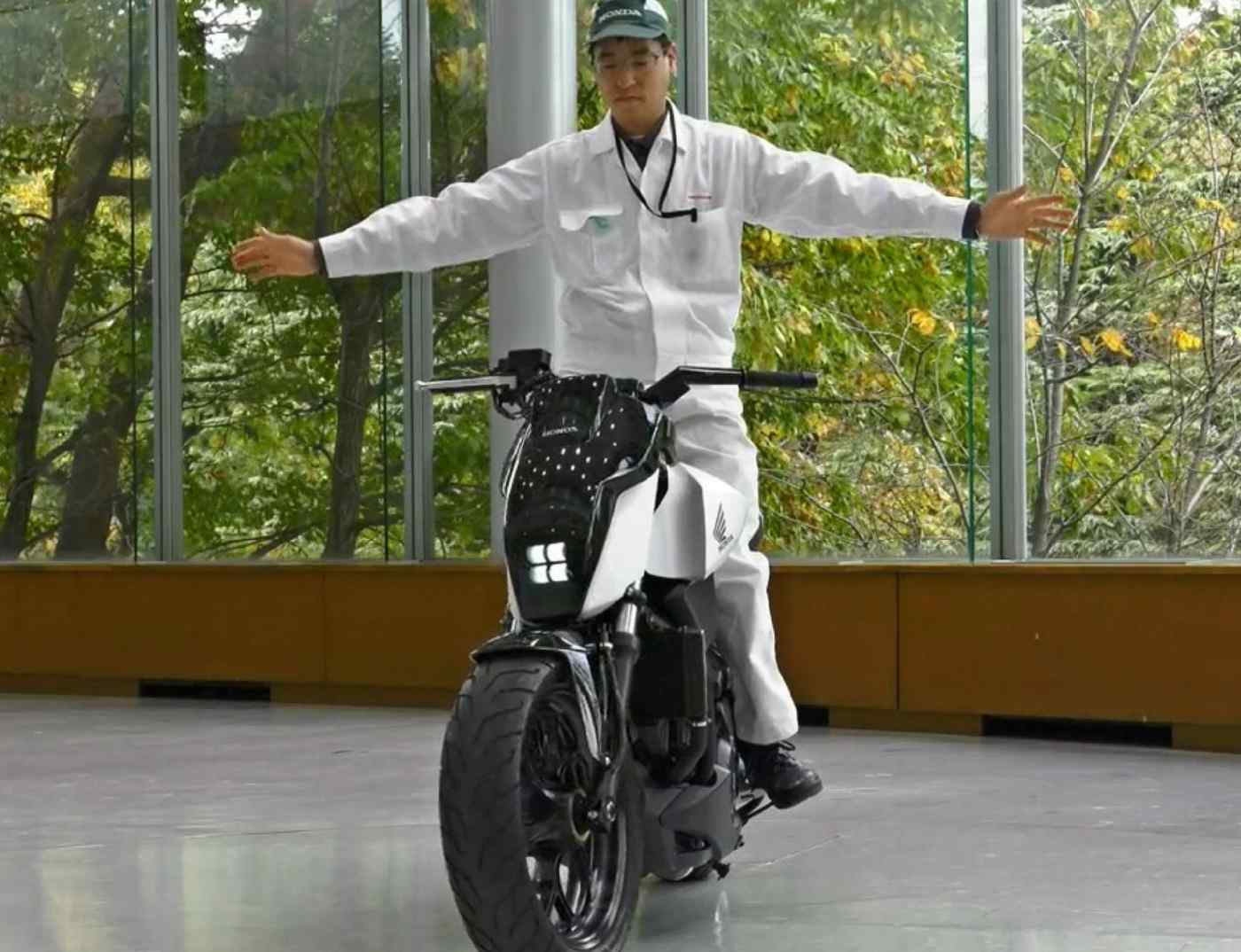 A Honda worker testing out the self-balancing motorcycle concept from Honda's labs. Photo courtesy of Asia Nikkei.
