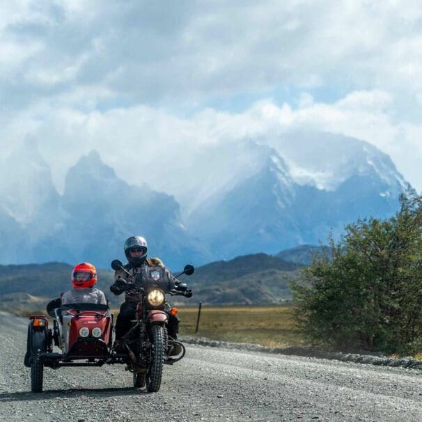 A Ural sidecar motorcycle set against a beautiful background. Media sourced from CycleWorld, via Ural.