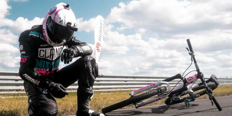 Elias Schwärzler and Geri Gesslbauer cracking the Guiness World Record for 'fastest ever standard bicycle towed by a motorbike.' Media sourced from Elias's Facebook.