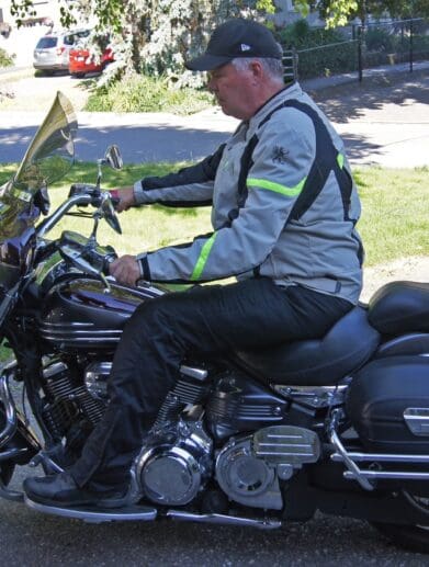 Author wearing Gryphon Moto Copper Canyon Pants while riding cruiser motorcycle