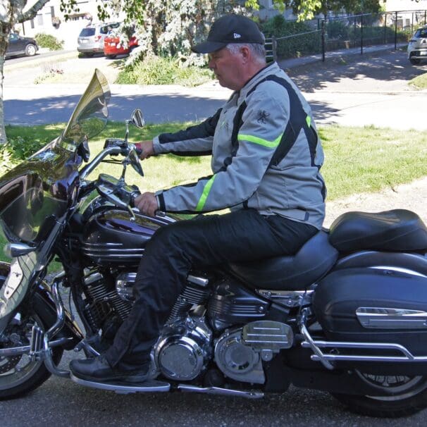 Author wearing Gryphon Moto Copper Canyon Pants while riding cruiser motorcycle