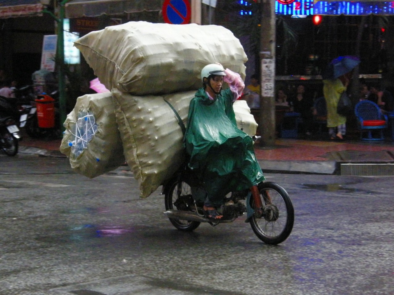 A Honda Super Cub 125 as a cargo hauler in Ho Chi Minh City, Vietnam