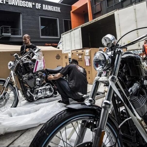 Harley-Davison employees working at a dealership. Media sourced from Hot Cars.