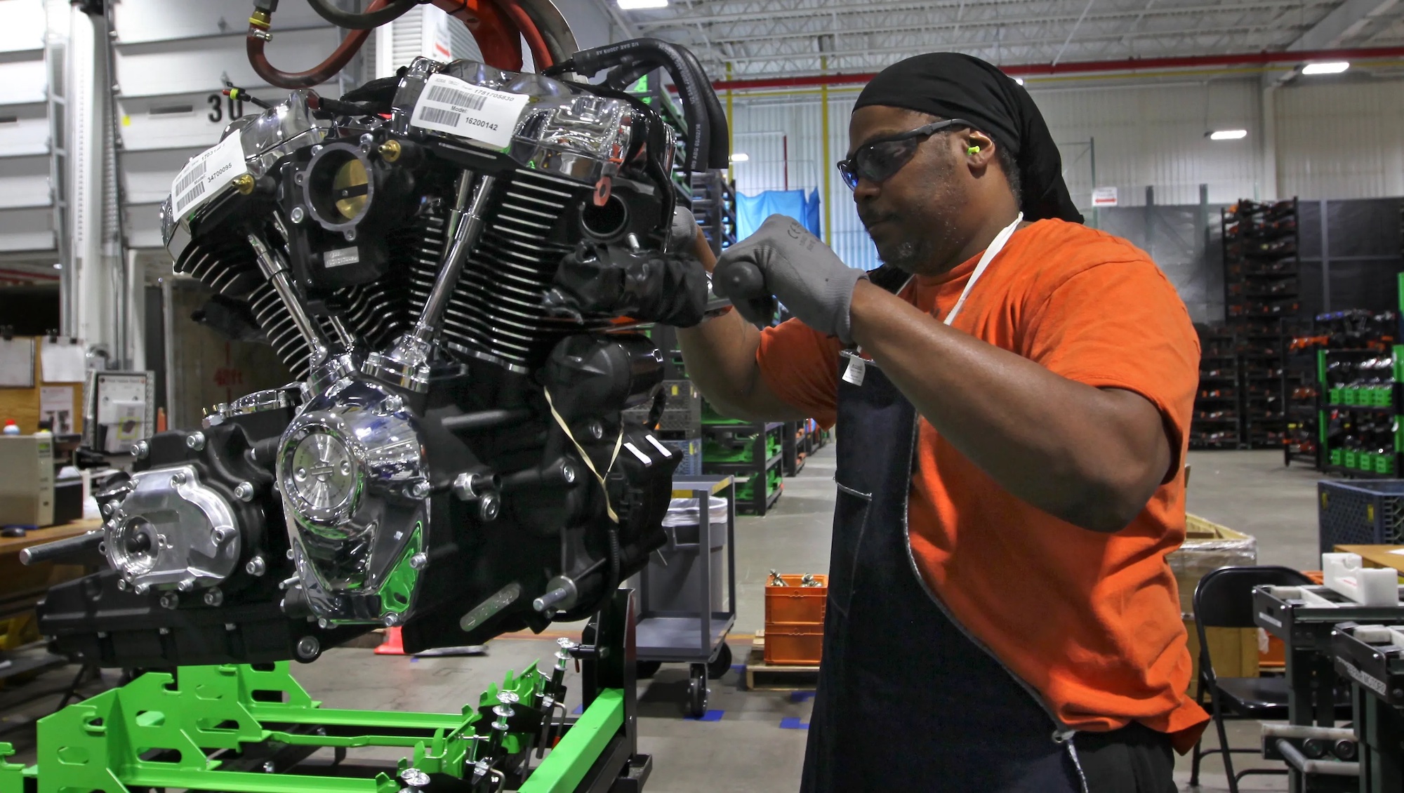A Harley employee working on an engine. Media sourced from the Milwaukee Sentinel Journal.