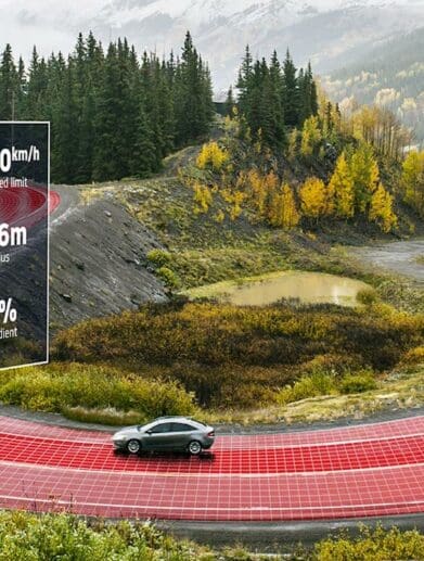 a car going around a bend, moderated by Intelligent speeding assistance. Media sourced from TomTom.