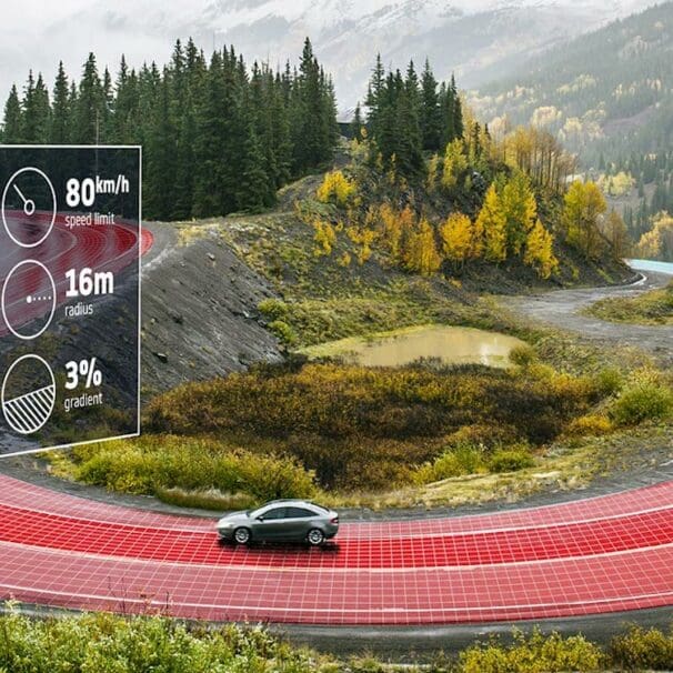 a car going around a bend, moderated by Intelligent speeding assistance. Media sourced from TomTom.