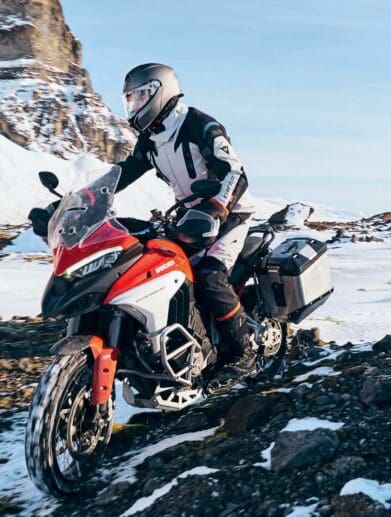 A rider trying out the AGV Tourmodular Helmet. Media sourced from Ultimate Motorcycling.