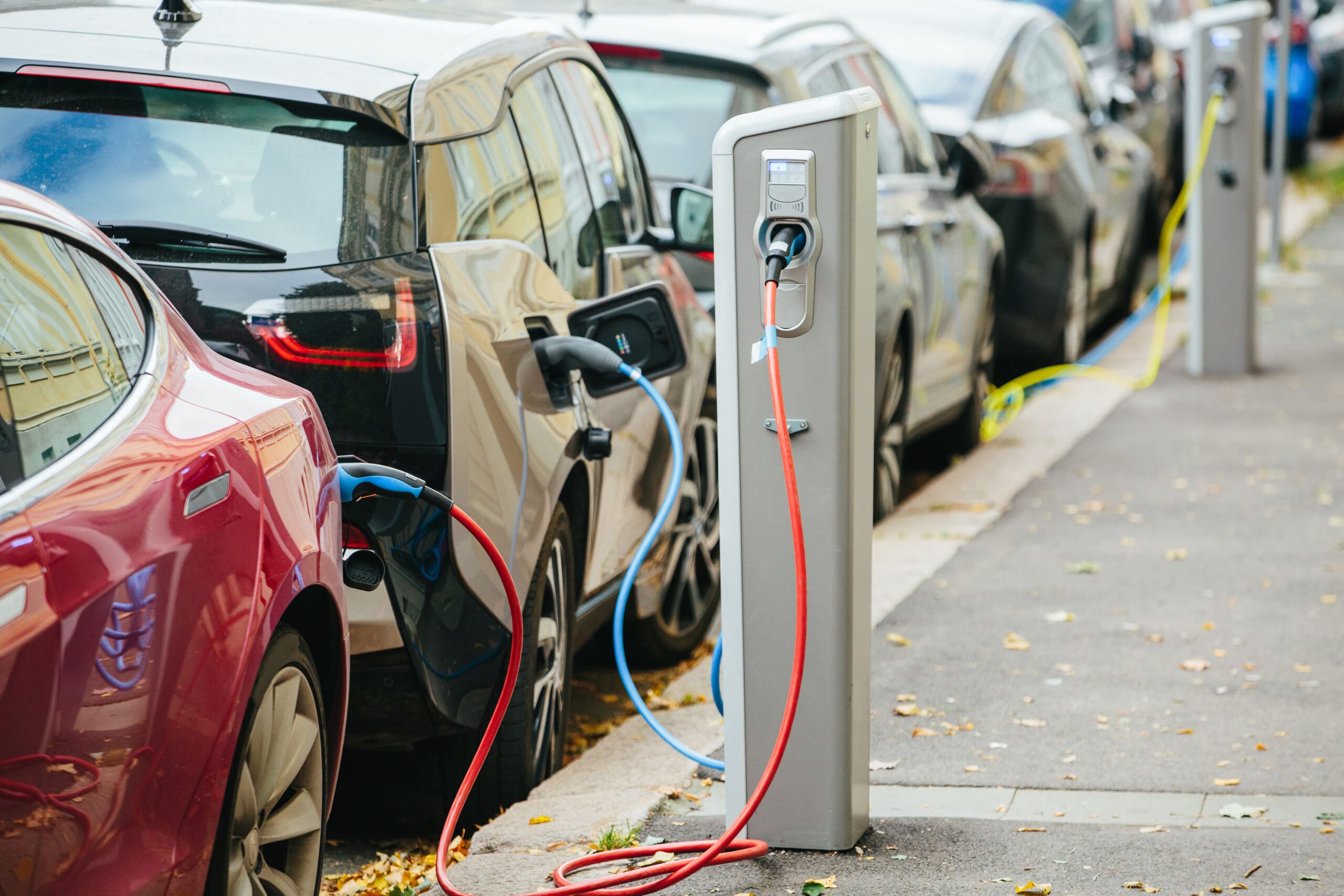 A line of electric cars charging at a station. Media sourced from the Anchorage Daily News.